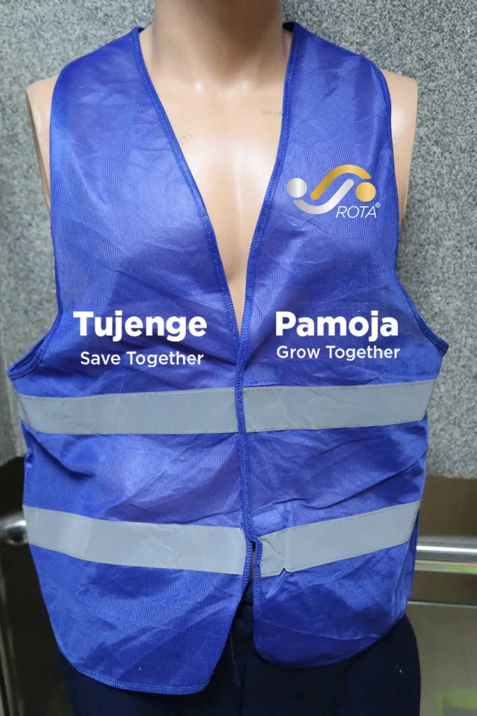 Branded reflector vest worn, showing print placement across both front panels