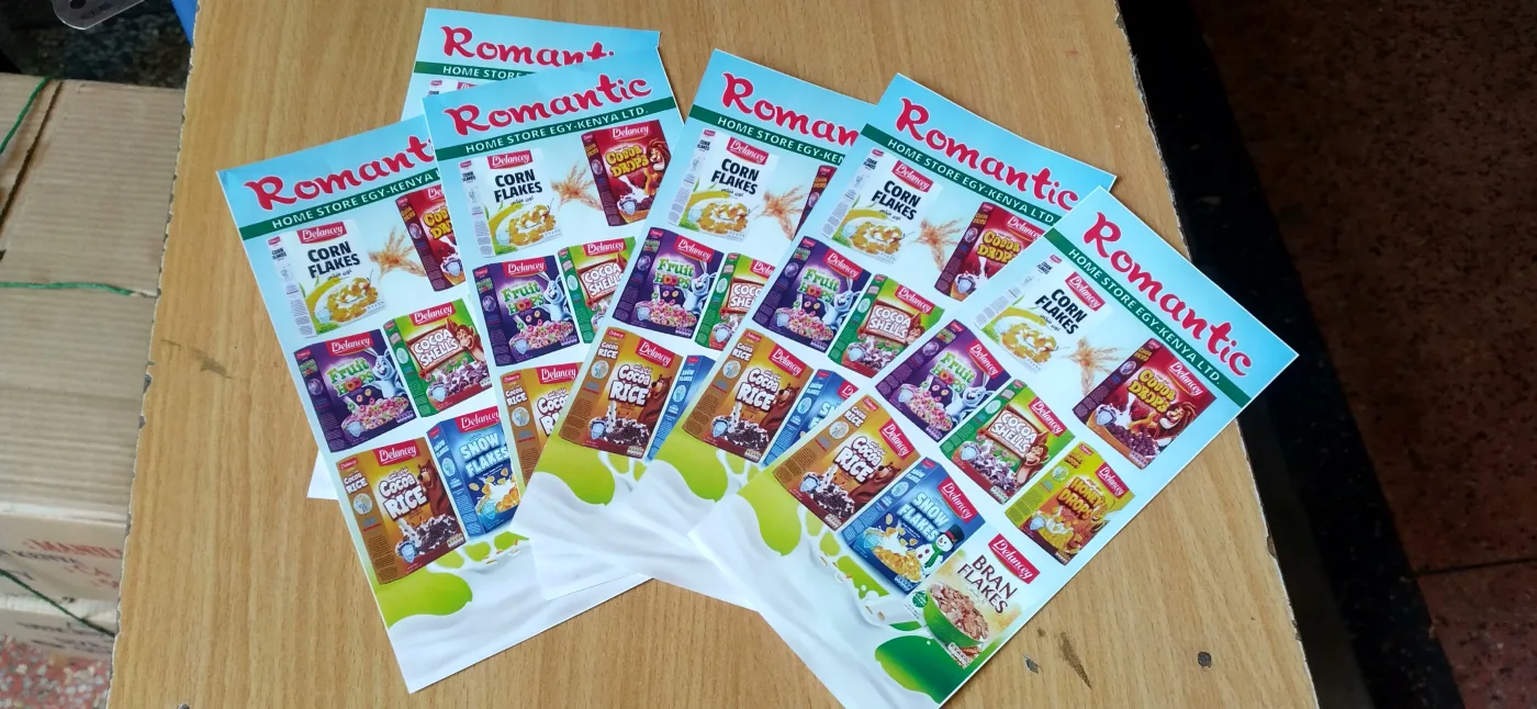 Fanned stack of full-colour promotional leaflets fresh off the guillotine
