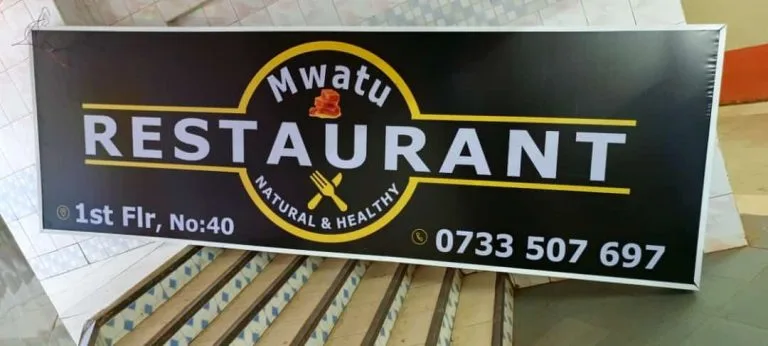 Printed restaurant fascia board finished with contact details, ready for handover