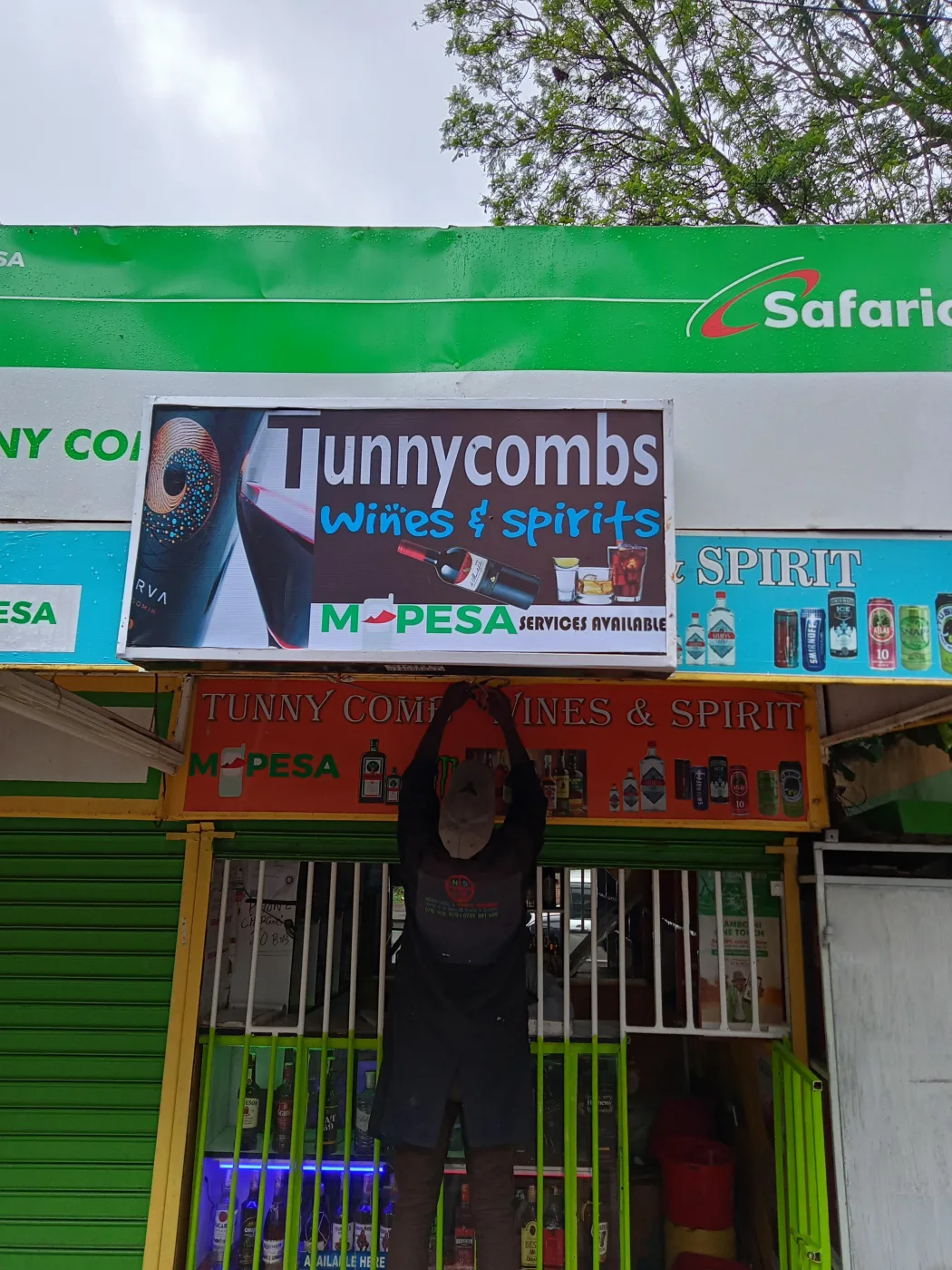 Full retail shopfront branded with fascia signage and side panels, installed