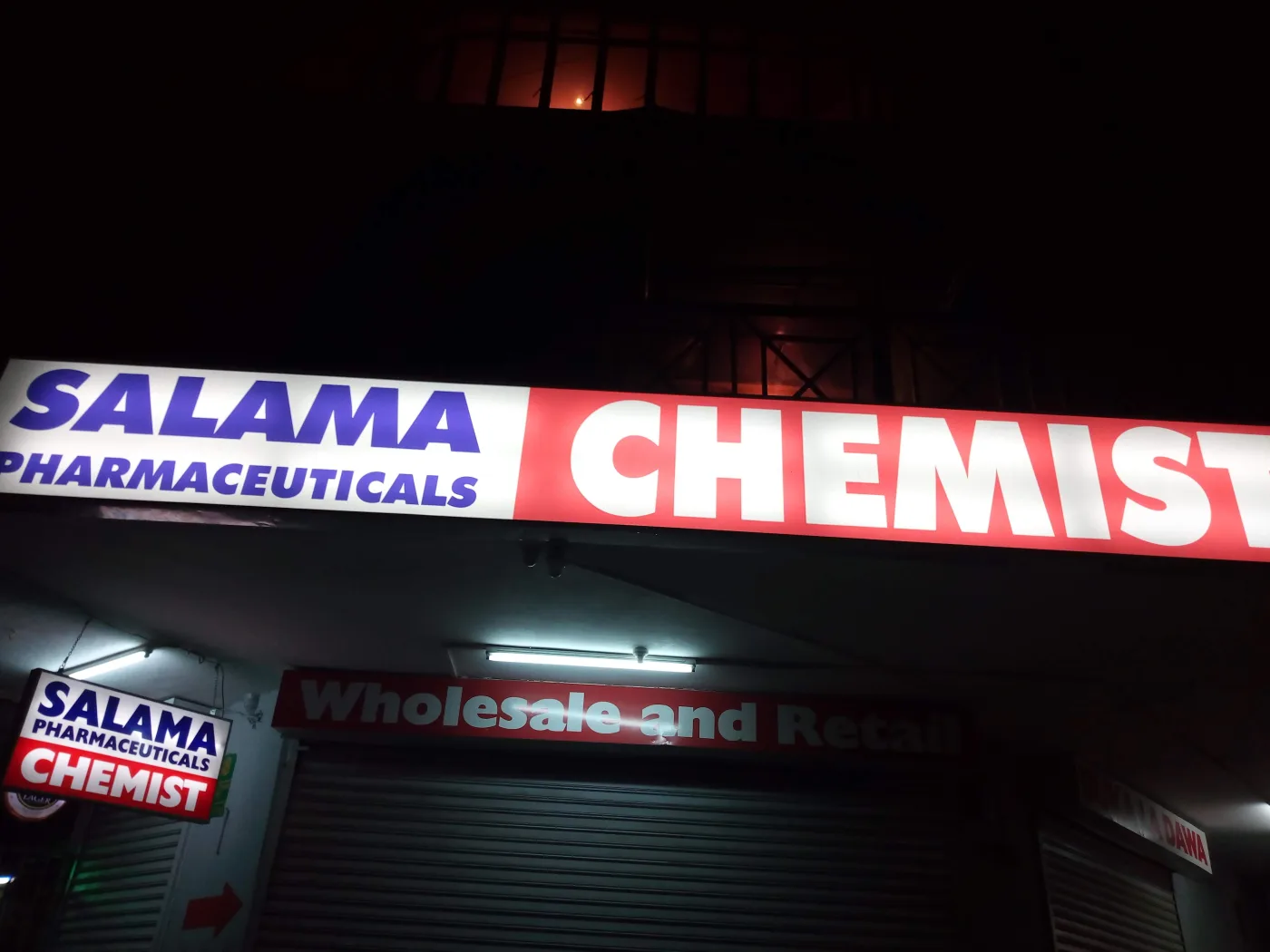 Pharmacy light box photographed at night showing even face illumination